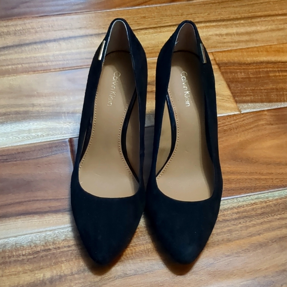 NEW. Calvin Klein size 6. Black wedge pumps.